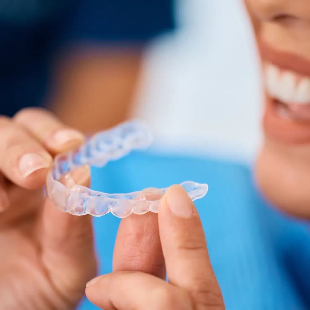 Patient wearing an OrthoAlign clear aligner